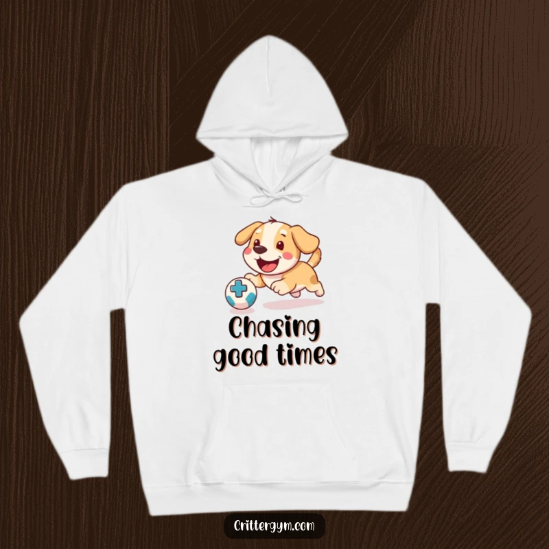 Funny Dog Medicine Ball Hoodie: A happy dog enthusiastically chases a medicine ball, depicted on this cozy, humorous hoodie.
