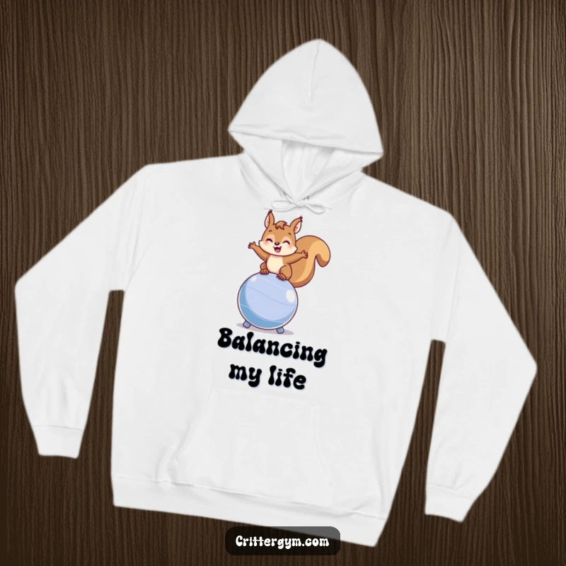 Funny squirrel hoodie featuring a happy squirrel balancing on a bouncing fitness ball, offering cozy warmth and humorous active vibes.