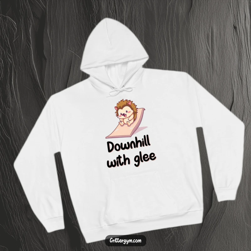 Funny happy hedgehog rolling down a slippery slide on a gym mat, on a cozy hoodie, a funny gift.