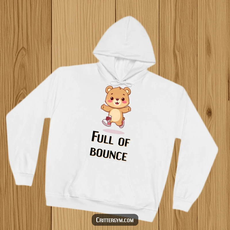Funny hoodie depicting a happy bear cub character wearing cartoon sneakers and doing a lively, playful hop. Cozy and humorous apparel.