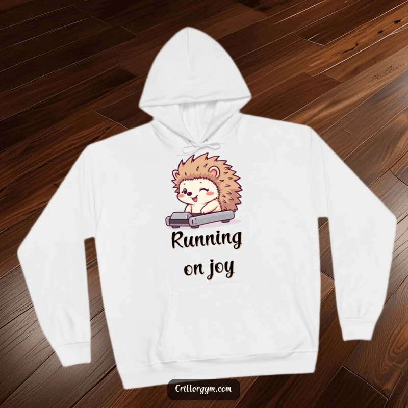 Funny hedgehog hoodie featuring a tiny character with a huge grin using a miniature treadmill, its quills wiggling.
