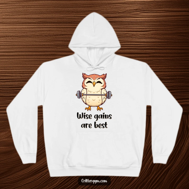 Warm and cozy hoodie featuring a funny, overjoyed owl balancing a small barbell on its beak.