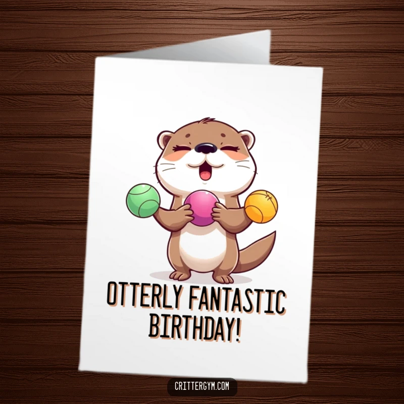 Funny Free Printable Birthday Card: A cheerful, winking otter expertly juggles three colorful exercise balls with a smile.