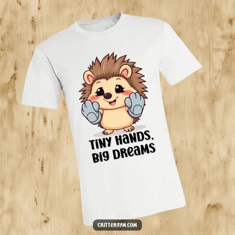Funny t-shirt featuring a smiling hedgehog attempting to wear oversized, cartoonish workout gloves.