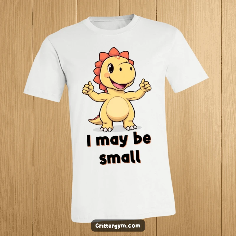 Funny t-shirt showcasing a joyful dinosaur character proudly flexing its impossibly tiny biceps with a confident grin and a humorous muscular display.