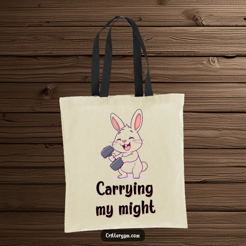 Funny rabbit gym tote bag featuring a smiling rabbit character comically failing to lift a tiny dumbbell, a humorous fitness accessory.