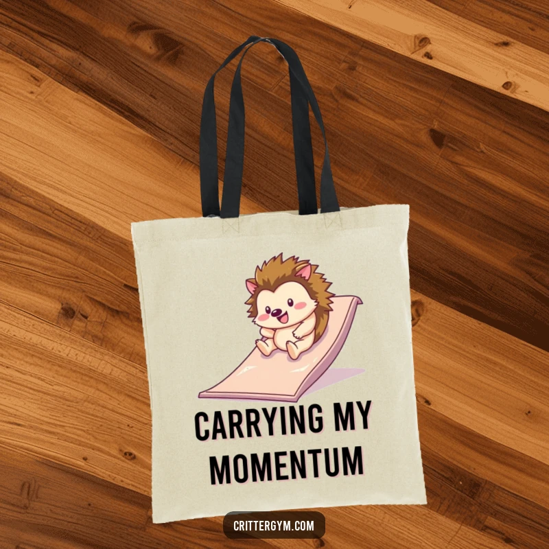 Funny tote bag featuring a happy hedgehog rolling down a slippery slide on a gym mat, perfect for carrying items with playful humor.