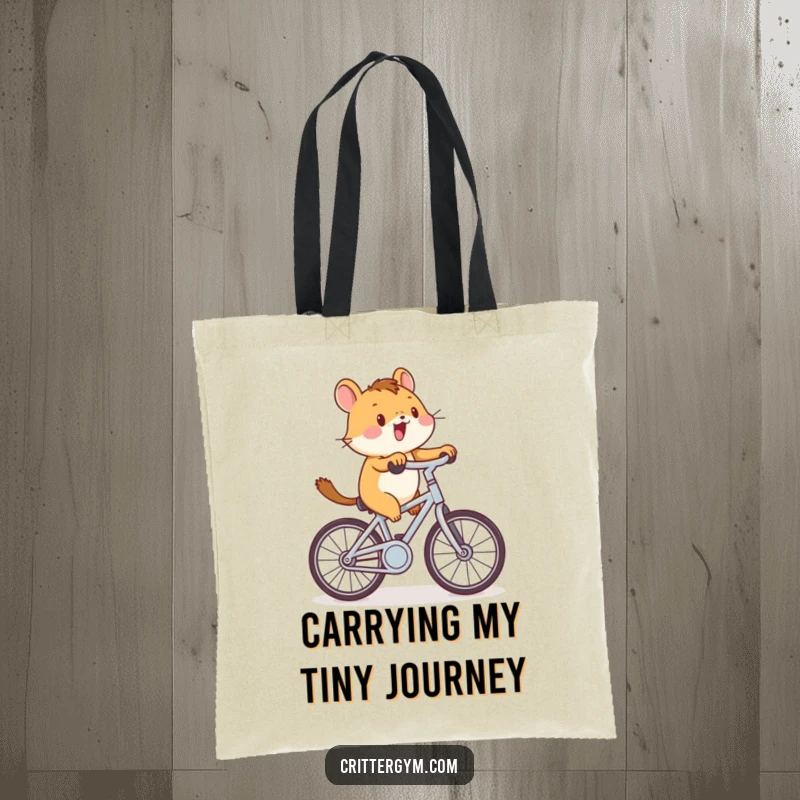 Funny critter cycling tote bag with a small animal enthusiastically riding a tiny stationary bike, great for carrying fitness essentials.